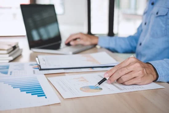 Man working on both financial/statutory and management reports