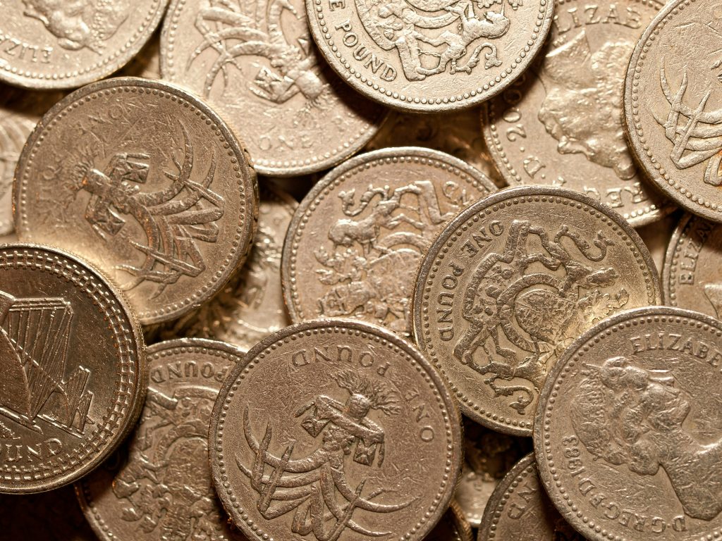 A stash of £1 coins to highlight how to spot cash flow problems